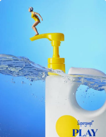 Supergoop Play pump bottle with a toy diver