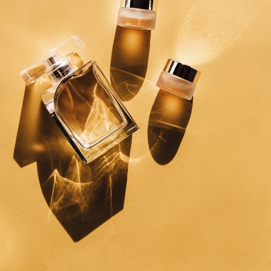 Perfume bottles on yellow