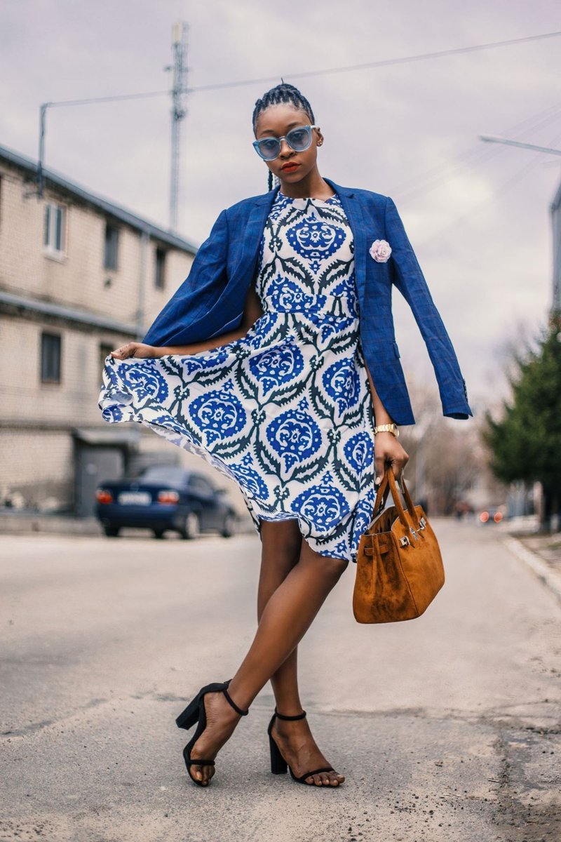 A woman in a blue print dress