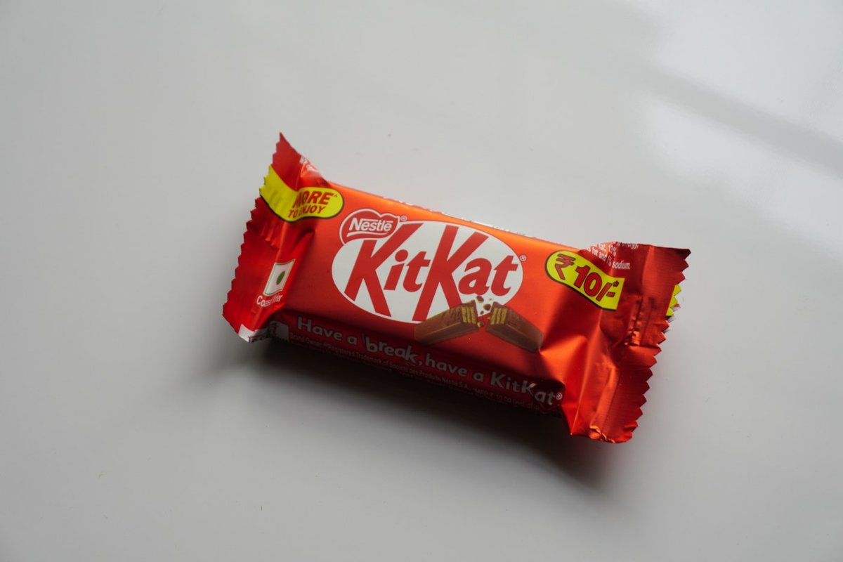 A red chocolate bar wrapper on white